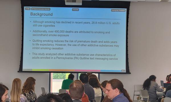 A wide shot of the PowerPoint presentation from Sophia Allen's talk.
