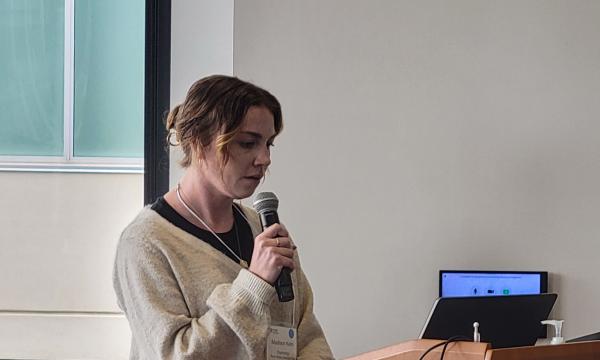 Madison Kelm, PhD, Doctoral Candidate in Psychology, College of the Liberal Arts, presents her talk.