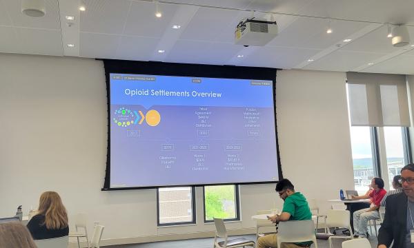 Wide shot of the presentation about the opioid settlement trust.