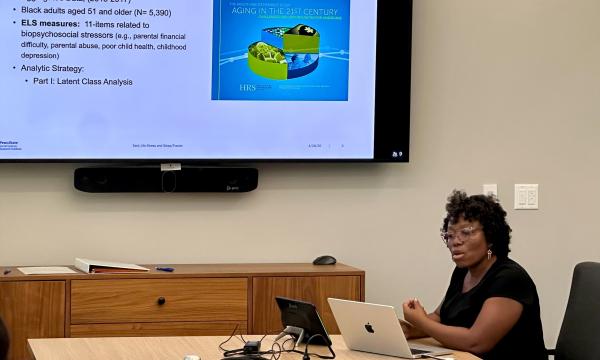 Cleothia Frazier, SSRI co-funded faculty member and assistant professor of sociology and demography, presents to the group.